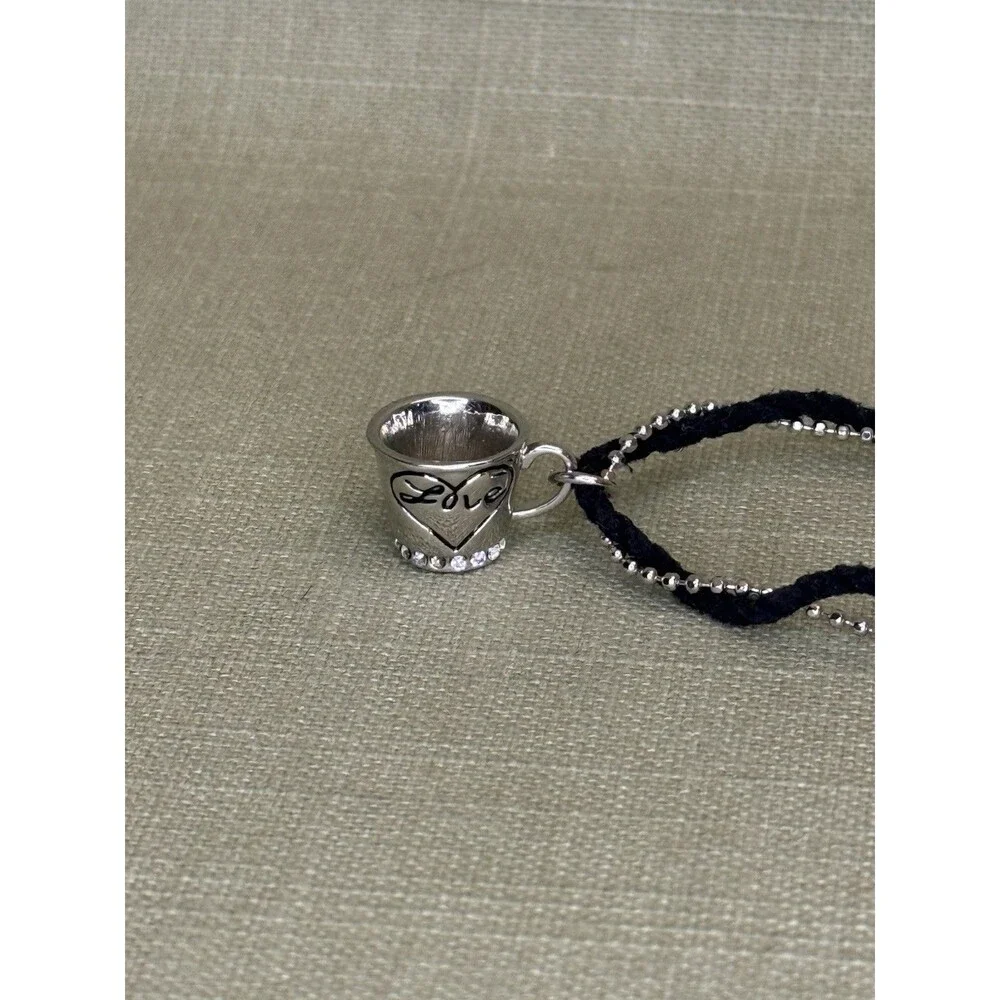 Delicate Silver And Black Cord Bracelet With Toggle Clasp with teacup cup charm
